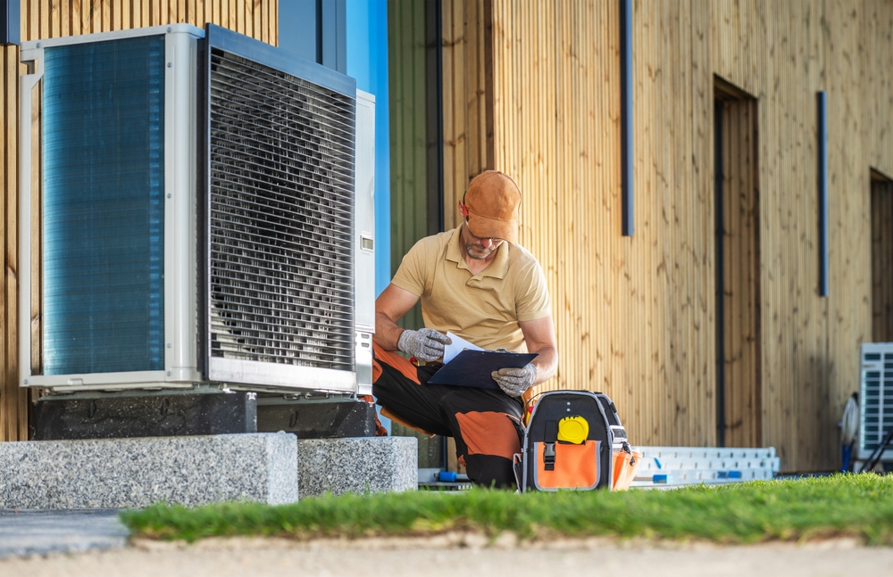 HVAC technician working on a heat pump